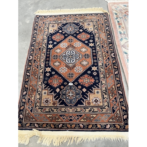 A Middle-eastern rug, 59in x 39in