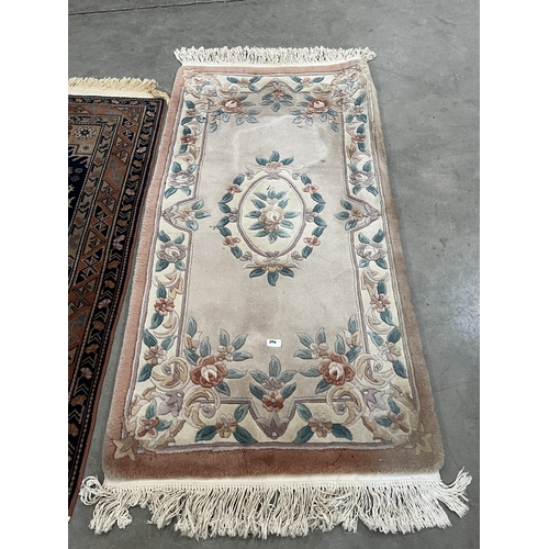 A Middle-eastern rug, 59in x 39in