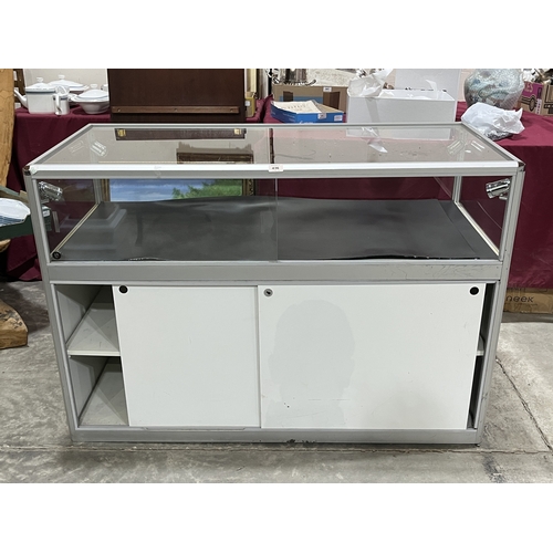 A shop display case. 52in wide