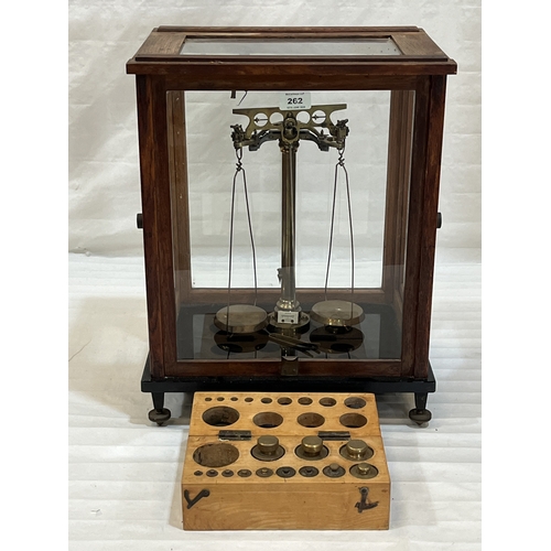 A cased set of German brass laboratory scales with a part set of ...