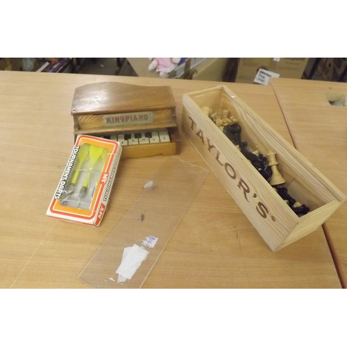 Vintage toy King Piano + darts and wooden chess pieces.