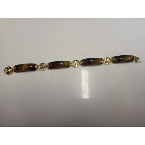 6 - 14ct gold 4 panel tigers eye bracelet 22.2g