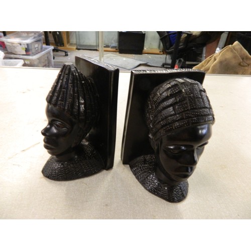 21 - Pair of heavy African bust ebony bookends.
