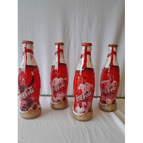 47 - 4 Collectors Designer Coca cola bottles
9 inches.