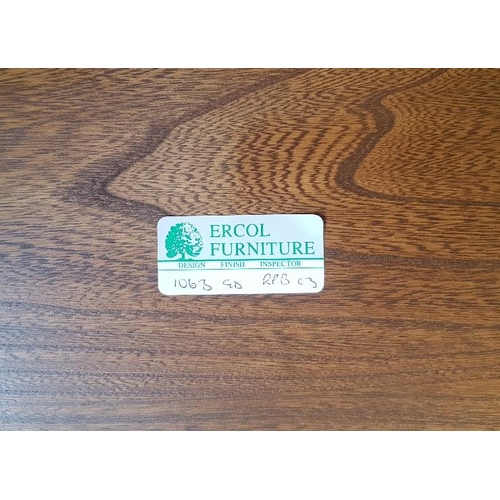 7 - Ercol Golden Dawn Elm Oval Coffee Table with smoked glass shelf underneath.  Size is 45 inches x 23 ... 