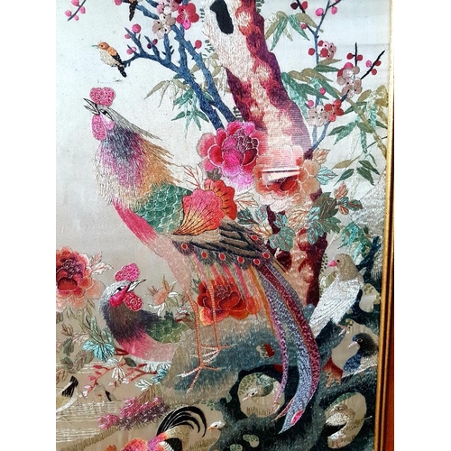 16 - Large Framed Chinese Embroidered Silk Panel decorated with peacocks and birds in foliage, measuring ... 