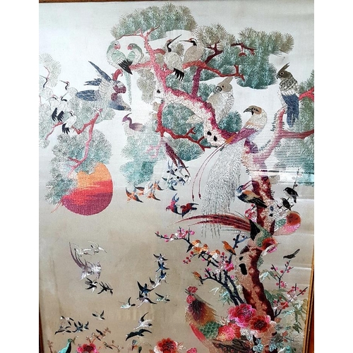 16 - Large Framed Chinese Embroidered Silk Panel decorated with peacocks and birds in foliage, measuring ... 