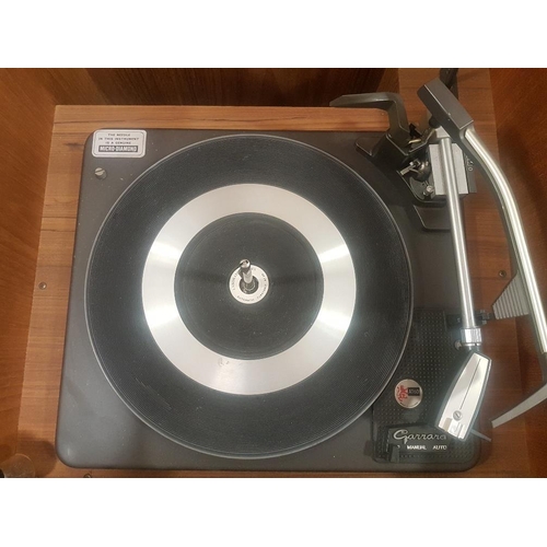 46 - Dynatron Teak Stereo Radiogram with lift up lid and Garrard Turntable, measuring 184cm in length.  W... 