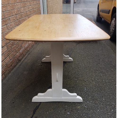 72 - A rectangular refectory Ercol dining table with painted base.  Top size is 54 inches x 28 inches