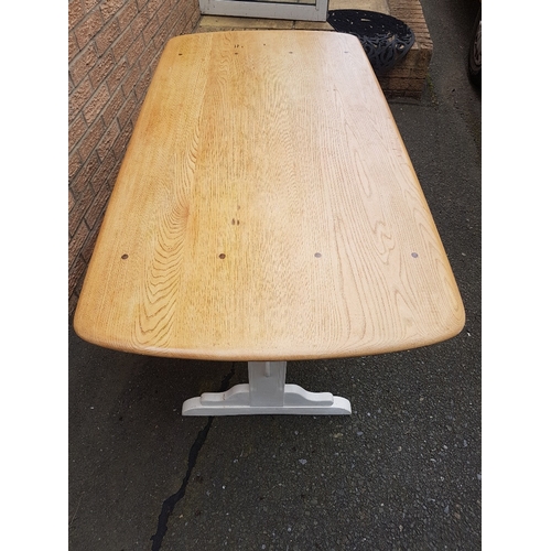 72 - A rectangular refectory Ercol dining table with painted base.  Top size is 54 inches x 28 inches