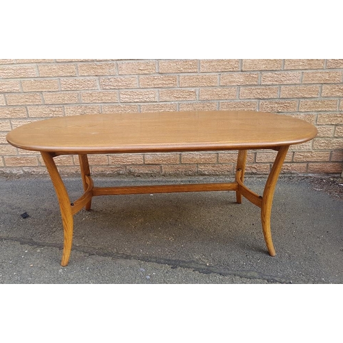 7 - Ercol Golden Dawn Elm Oval Coffee Table with smoked glass shelf underneath.  Size is 45 inches x 23 ... 