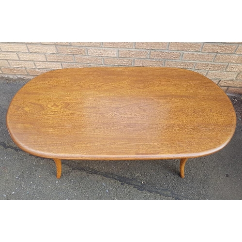 7 - Ercol Golden Dawn Elm Oval Coffee Table with smoked glass shelf underneath.  Size is 45 inches x 23 ... 