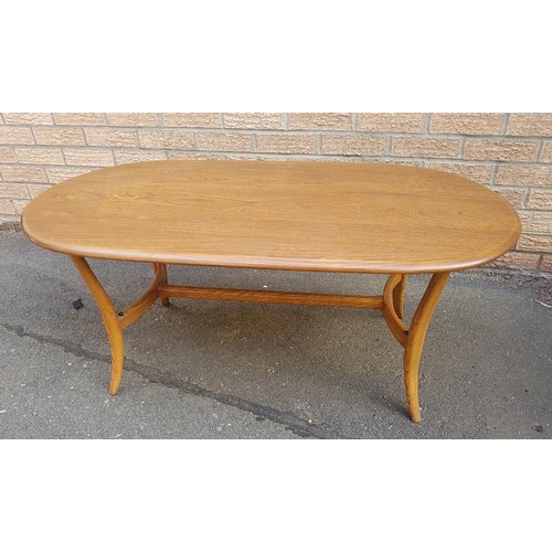 7 - Ercol Golden Dawn Elm Oval Coffee Table with smoked glass shelf underneath.  Size is 45 inches x 23 ... 