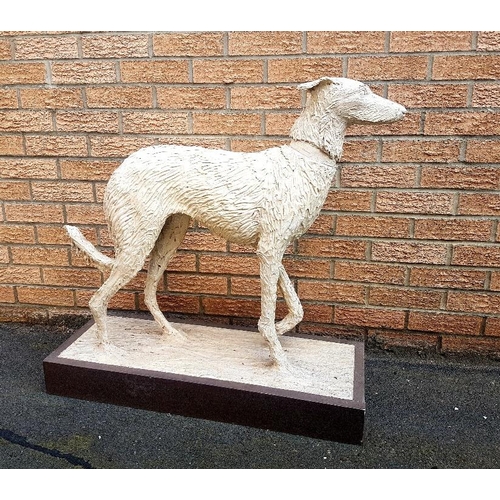 44 - Lifesize realistic Ceramic Sculpture of a Lurcher dog on a wooden plinth, measuring 87cm in height x... 