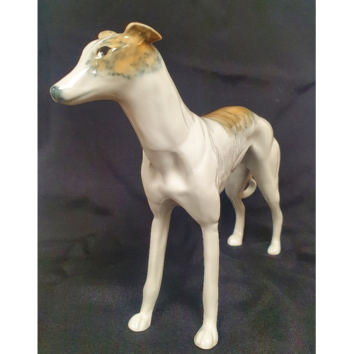 55 - A Ceramic Greyhound or Lurcher Figurine measuring 8 inches in height, no maker marks.