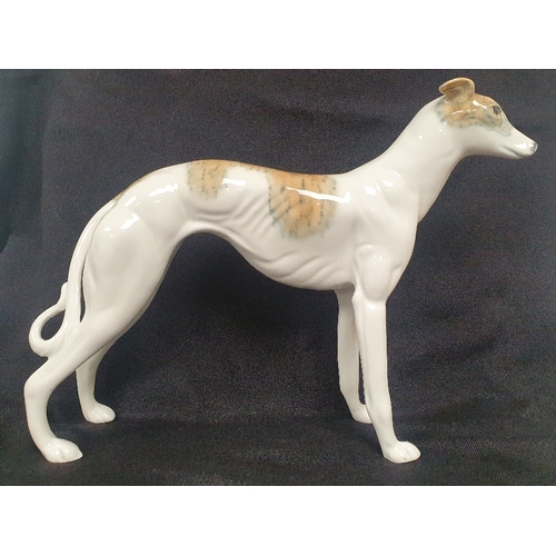 55 - A Ceramic Greyhound or Lurcher Figurine measuring 8 inches in height, no maker marks.