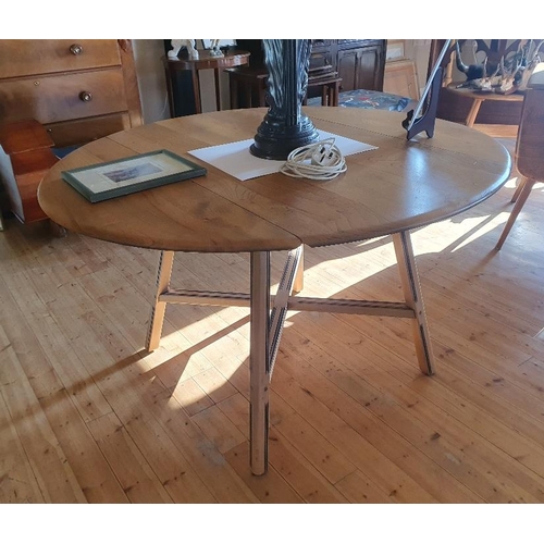 44 - Ercol Oval Drop Leaf Dining Table, Product Number 377.   Extended size is 48 inches x 44 inches.