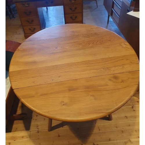 44 - Ercol Oval Drop Leaf Dining Table, Product Number 377.   Extended size is 48 inches x 44 inches.