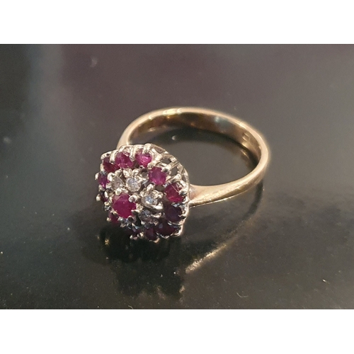 15 - 9ct Gold Ring Set With 6 Small Diamonds, surrounded by Rubies, weight 2.92g