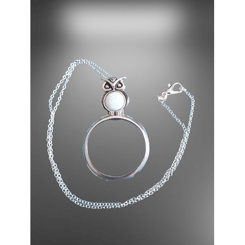 39 - Silver Magnifying Pendant on a white metal Necklace. Stylised as an Owl with an Opal Cabuchon