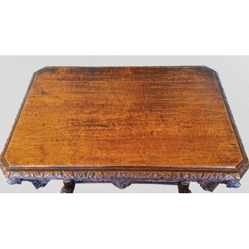 1 - Ornate heavily carved oak Jacobean Revival Library Table with long disguised drawer to the front wit... 