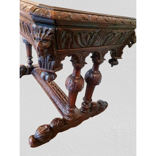 1 - Ornate heavily carved oak Jacobean Revival Library Table with long disguised drawer to the front wit... 