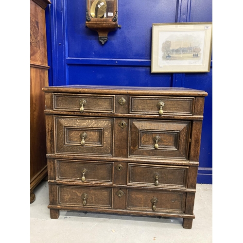 127 - 18th cent. English oak geometric chest of four drawers. Four moulded drawers with brass pear drop ha... 