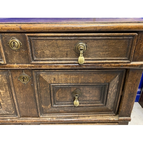 127 - 18th cent. English oak geometric chest of four drawers. Four moulded drawers with brass pear drop ha... 