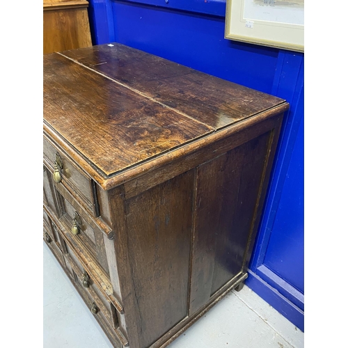 127 - 18th cent. English oak geometric chest of four drawers. Four moulded drawers with brass pear drop ha... 