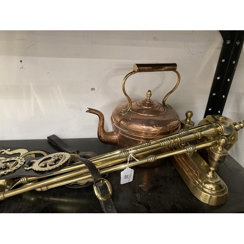 23 - 20th cent. Metalware: Brass companion set, tea caddy, horse brasses and copper kettle.