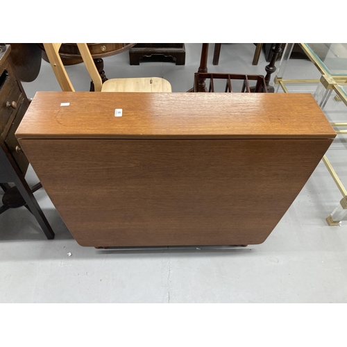 32 - 1970s teak drop leaf table, retailed by McIntosh. 59ins. x 36ins extended. 8½ins. x 36ins stowed.