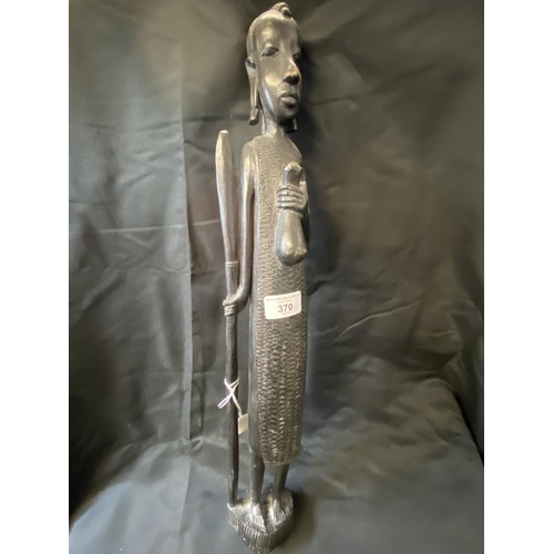 370 - Tribal Art: Treen carved figure of a Masai Warrior with spear and gourd. 24ins.