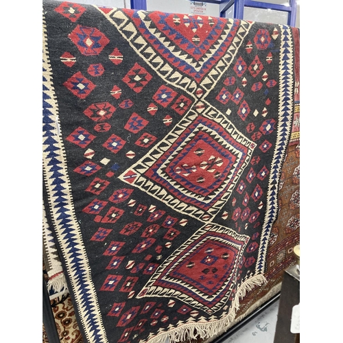 41 - Rugs: 20th cent. Eastern black ground runner with geometric decoration. Approx. 38ins. x 78ins.