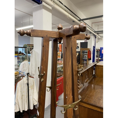 48 - Aesthetic style rosewood hall/coat stand with cruciform hat peg top. Height 73½ins.