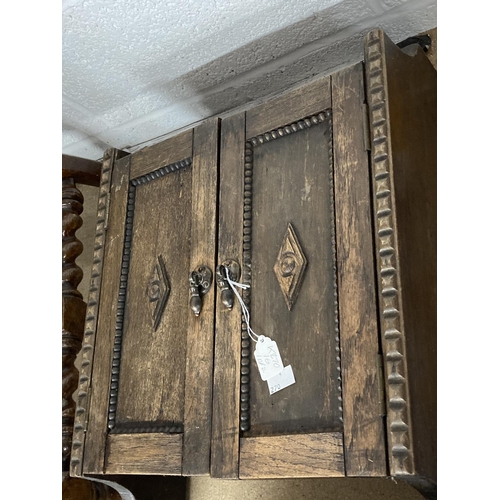 5 - 20th cent. Oak wall mounted cupboard, with applied beaded and diamond shaped mouldings. 20ins. x 15i... 