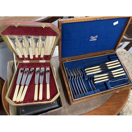 52 - Plated Ware: Early 20th cent. Oak cased six place cutlery set, plus a boxed fruit set (six settings)... 