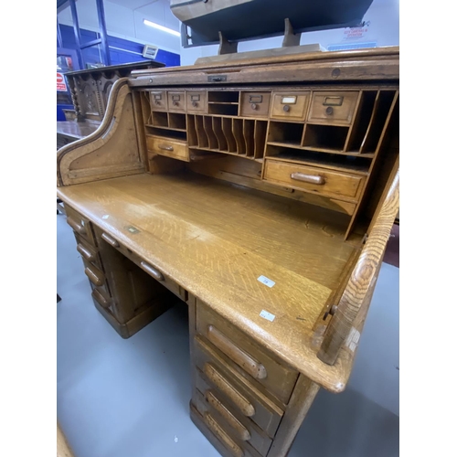 78 - 20th cent. Oak double pedestal tambour front desk with fully fitted interior. 50ins. x 49½ins. x 32i... 