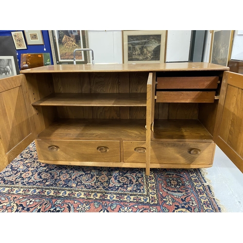 86 - 20th cent. Ercol style Windsor oak sideboard. Three cupboards over two drawers with two cutlery draw... 