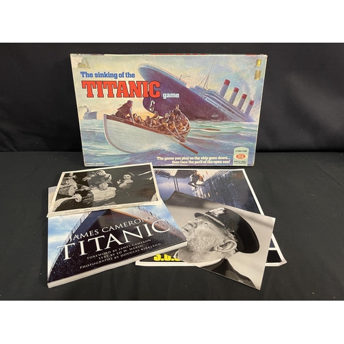 34 - R.M.S. TITANIC: Lobby cards & photos to include SOS Titanic, Night to Remember, The Sinking of the T... 