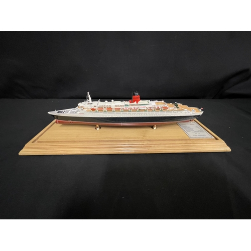 58 - OCEAN LINER: Scale model of the Cunard Queen Elizabeth II by Maritime Replicas. Mounted on pine base... 