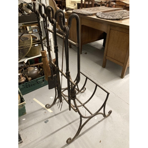 33 - Metalware: Wrought iron log and tool holder, rods with reef knot decoration, brush, shovel, tongs an... 