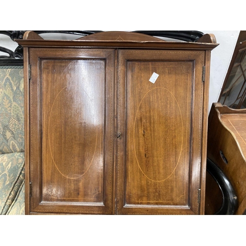 42 - Edwardian mahogany bathroom set comprising a pot cupboard 15ins. x 13ins. x 31ins, and wall cabinet ... 