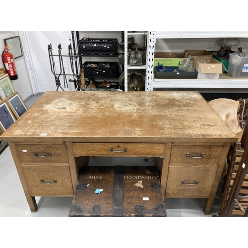 17 - 20th cent. Oak five drawer desk with two brushing slides on square legs terminating with brass caps,... 