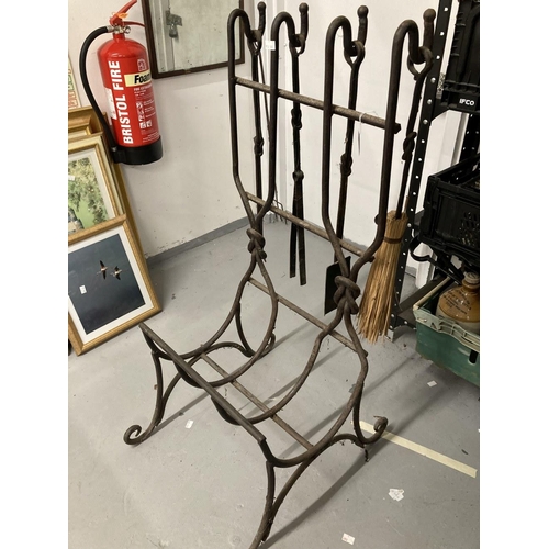 33 - Metalware: Wrought iron log and tool holder, rods with reef knot decoration, brush, shovel, tongs an... 