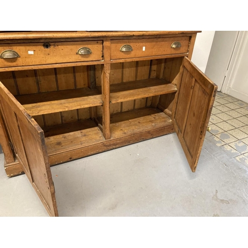 1 - 19th cent. Pine dresser the top with moulded cornice and three graduated shelves. The base with two ... 