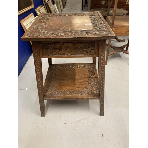 102 - 20th cent. Oak arts and crafts table carved floral relief the top opening to reveal storage. 18ins. ... 