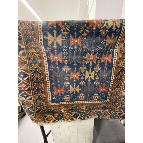 11 - Carpets & Rugs: Caucasian, possibly Kazak, rug. Blue ground with geometric designs and six borders i... 