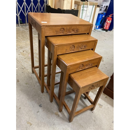 110 - 20th cent. Oriental/Chinese teak nest of four tables with carved decoration.