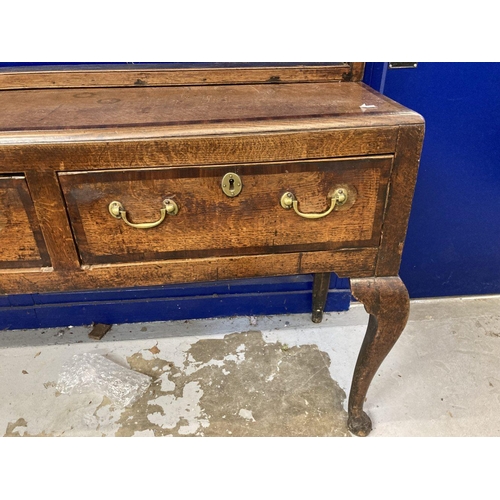 116 - 18th cent. Oak dresser the base with three drawers brass handles crossbanded with mahogany on cabrio... 