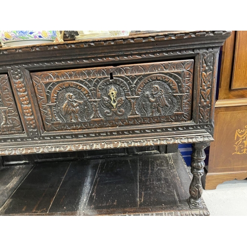 120 - 19th cent. Northern European sideboard/court cupboard with heavily carved front and back. 55ins. x 7... 